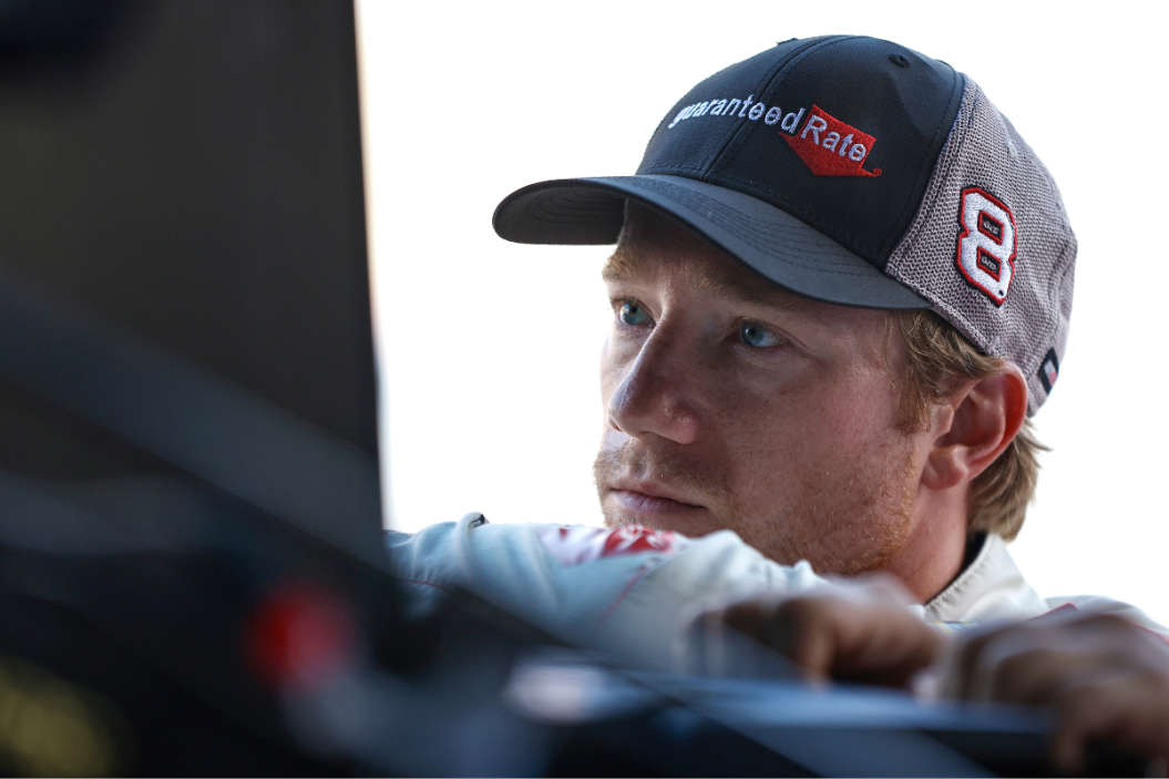 Tyler Reddick looks on in the garage area during practice for the NASCAR Cup Series FireKeepers Casino 400 at Michigan International Speedway on August 06, 2022