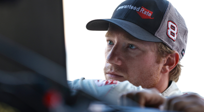 Tyler Reddick looks on in the garage area during practice for the NASCAR Cup Series FireKeepers Casino 400 at Michigan International Speedway on August 06, 2022