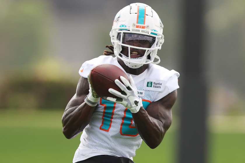 Tyreek Hill #10 of the Miami Dolphins catches a pass during training camp at Baptist Health Training Complex