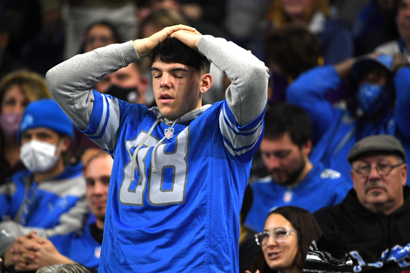 A Detroit Lions fan in disbelief after losing to the Minnesota Vikings