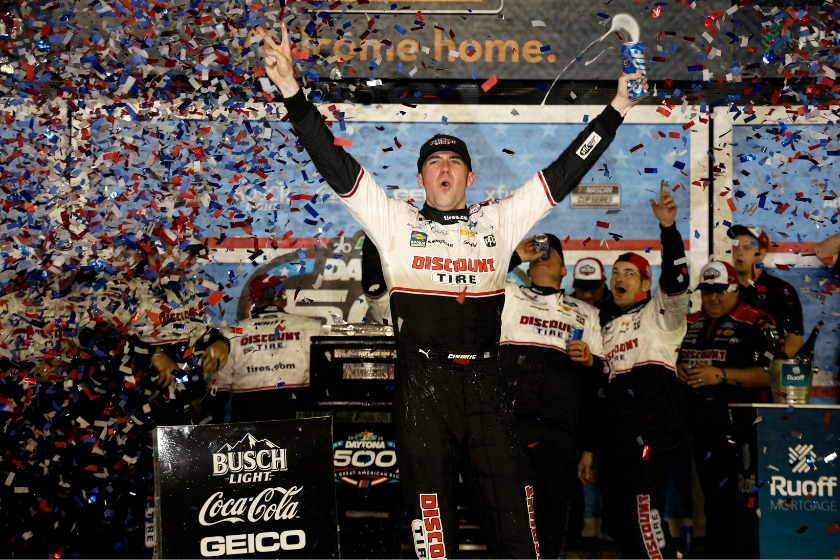 Austin Cindric celebrates in the Ruoff Mortgage victory lane after winning the 2022 Daytona 500 at Daytona International Speedway