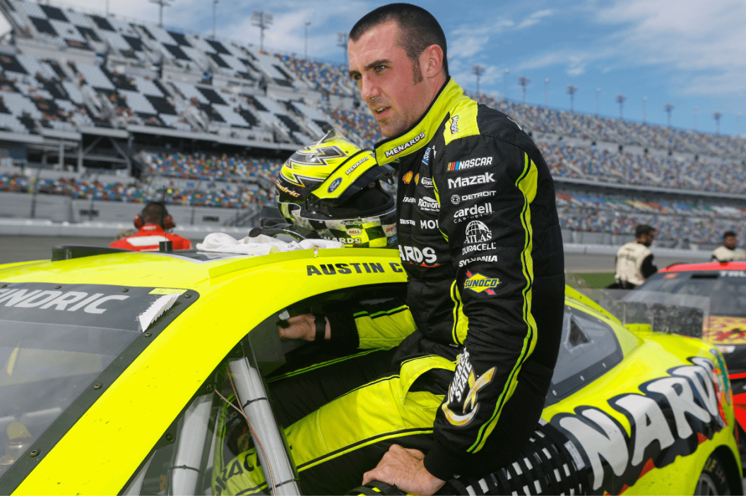 Austin Cindric enters his car to race after a weather delay in the 2022 Coke Zero Sugar 400 at Daytona International Speedway