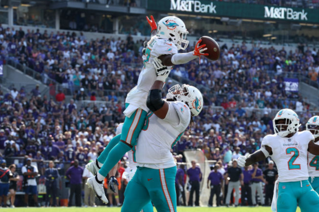 Wide receiver Jaylen Waddle #17 of the Miami Dolphins celebrates after catching a touchdown pass late in the fourth quarter against the Baltimore Ravens