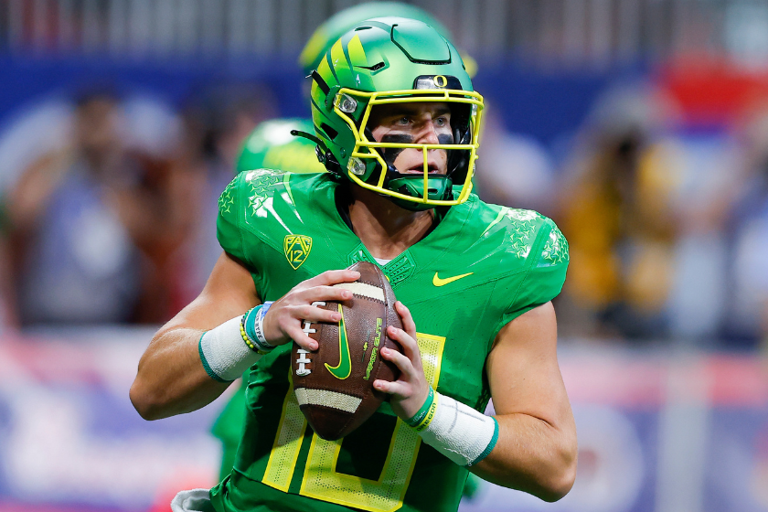 Bo Nix #10 of the Oregon Ducks drops back to pass during the first half of the Chick-fil-A Kick-Off Game against the Georgia Bulldogs
