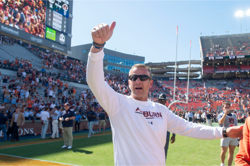Bryan Harsin waves to the crowd after Auburn's win over Missouri.