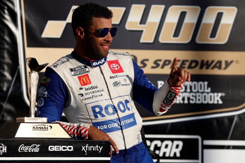 Bubba Wallace celebrates in victory lane after winning the 2022 Hollywood Casino 400 at Kansas Speedway
