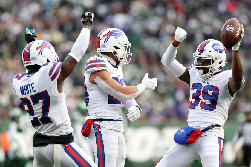 Levi Wallace #39 of the Buffalo Bills celebrates his interception with teammates Tre'Davious White #27 and Taron Johnson #24