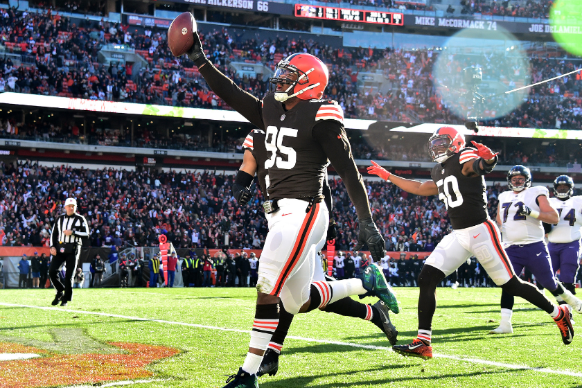 Myles Garrett #95 of the Cleveland Browns celebrates after running the ball in for a touchdown after a fumble recovery