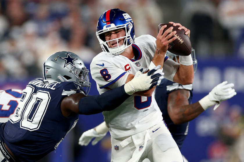 Daniel Jones #8 of the New York Giants tries to avoid DeMarcus Lawrence #90 of the Dallas Cowboys