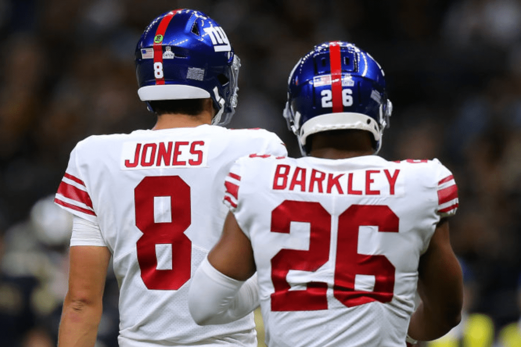 Daniel Jones #8 of the New York Giants and Saquon Barkley #26 react against the New Orleans Saints during a game at the Caesars Superdome