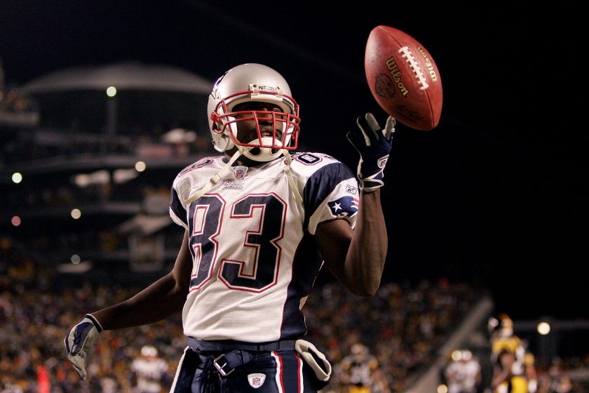 Deion Branch #83 of the New England Patriots celebrates after scoring a touchdown in the first quarter of the AFC championship game