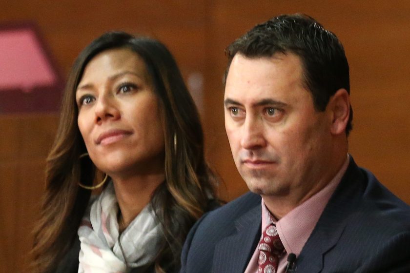 Steve Sarkisian and ex-wife Stephanie sit together at a press conference.