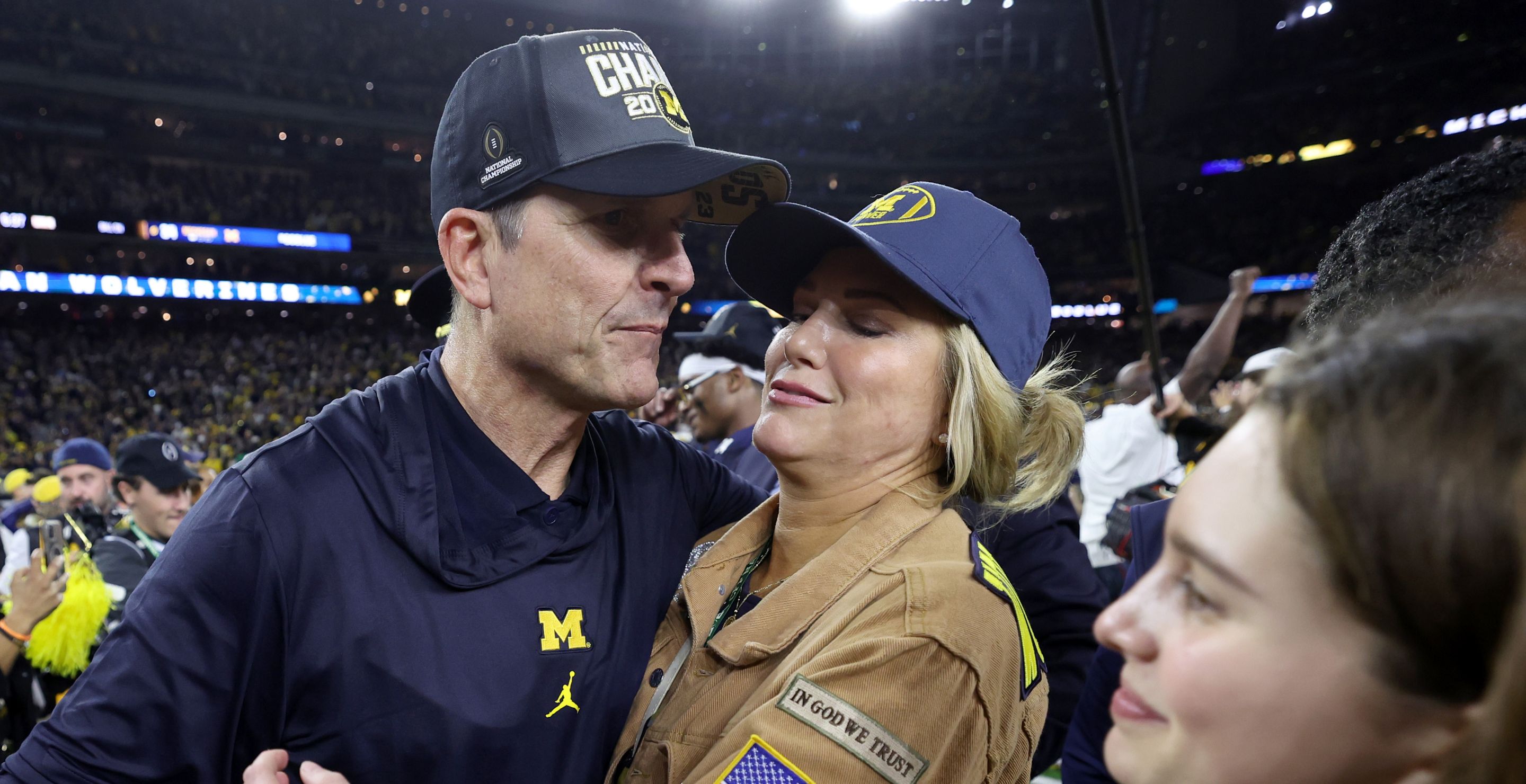Jim Harbaugh and his wife celebrate after winning the national title.