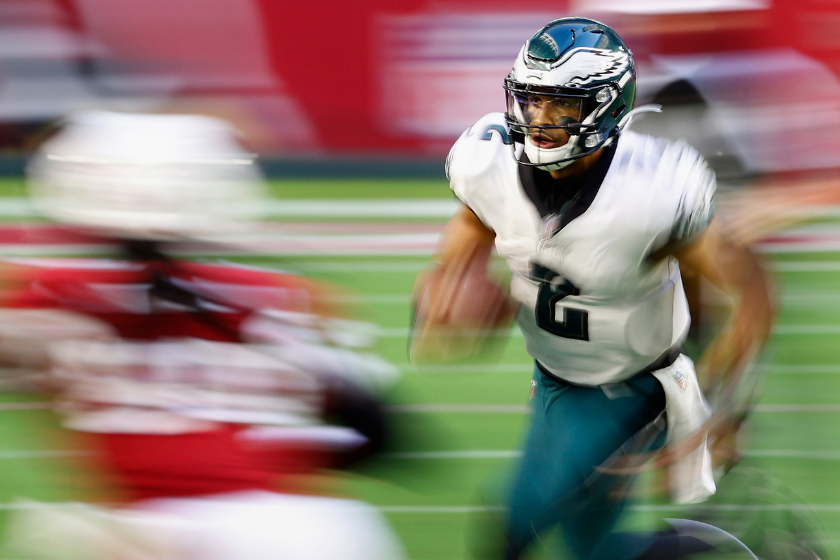 Quarterback Jalen Hurts #2 of the Philadelphia Eagles scrambles with the football against the Arizona Cardinals during the third quarter of the NFL game