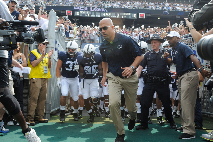James Franklin leads Penn State out of the tunnel in 2014.