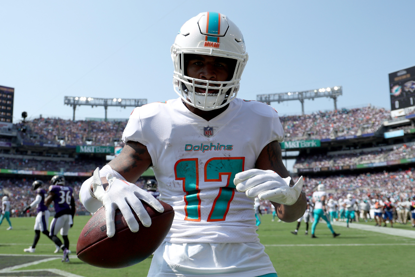 Wide receiver Jaylen Waddle #17 of the Miami Dolphins celebrates after catching a firs half touchdown pass