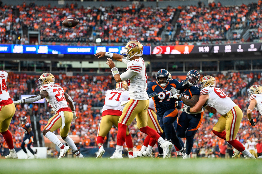 San Francisco 49ers quarterback Jimmy Garoppolo (10) sets to pass against the Denver Broncos in the first half during a game