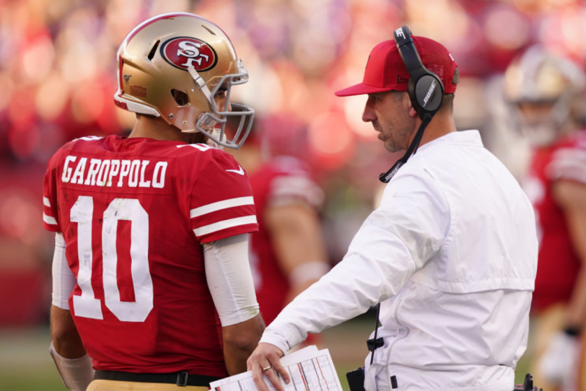 Jimmy Garoppolo #10 speaks with head coach Kyle Shanahan of the San Francisco 49ers during the NFC Divisional Round Playoff game against the Minnesota Vikings