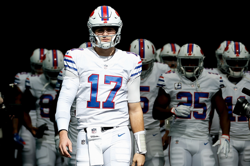 Josh Allen #17 of the Buffalo Bills leads the team on to the field prior to the game between the Miami Dolphins and the Buffalo Bills