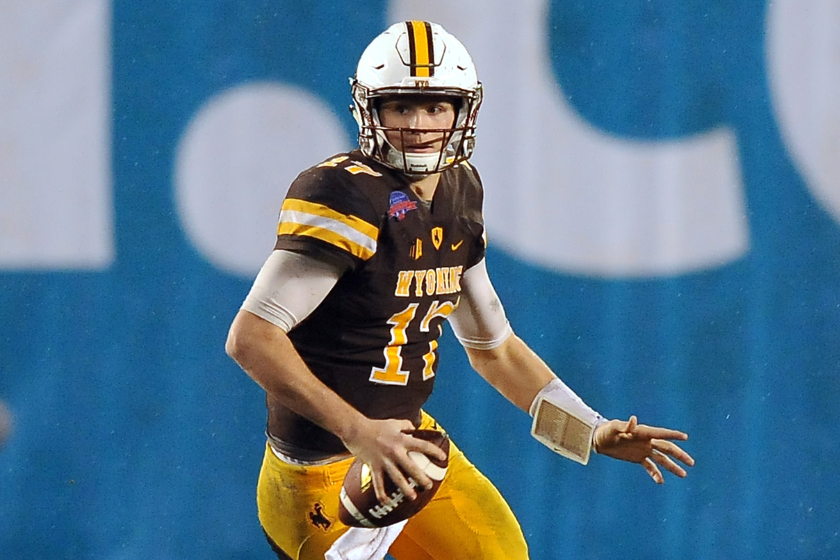 Wyoming Cowboys quarterback Josh Allen (17) scrambles for a gain during the fourth quarter against the BYU Cougars 