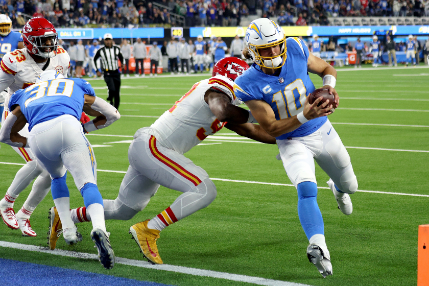 Justin Herbert #10 of the Los Angeles Chargers runs the ball into the end zone for a touchdown in the second quarter of the game against the Kansas City Chiefs