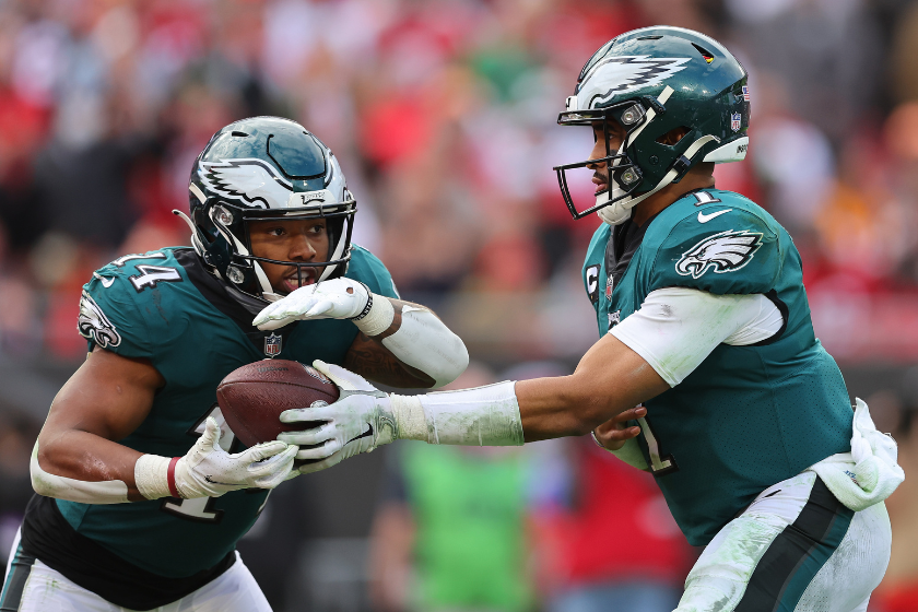 Jalen Hurts #1 of the Philadelphia Eagles hands the ball off to Kenneth Gainwell #14 against the Tampa Bay Buccaneers 