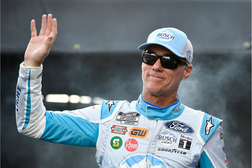 Kevin Harvick waves to fans as he walks onstage during driver intros prior to the 2022 Cook Out Southern 500 at Darlington Raceway