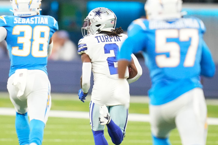 KaVontae Turpin #2 of the Dallas Cowboys runs a punt back for a touchdown against the Los Angeles Charger