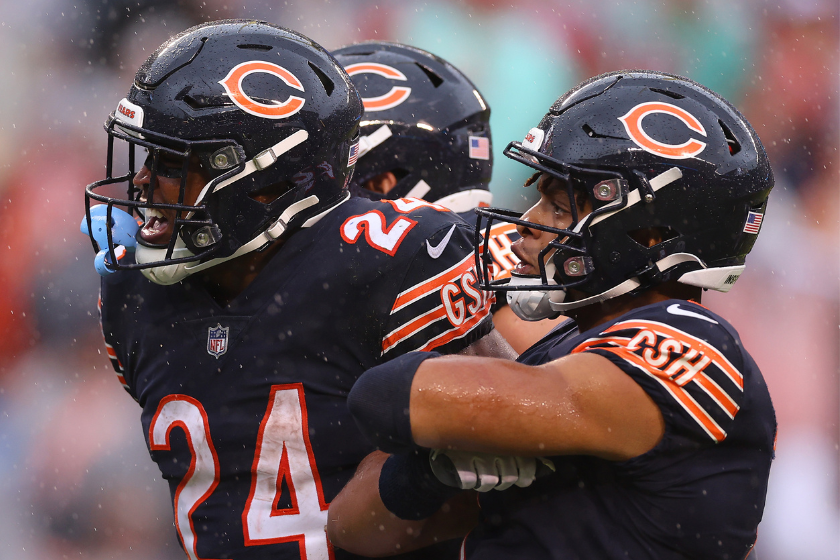 Running back Khalil Herbert #24 of the Chicago Bears and quarterback Justin Fields #1 of the Chicago Bears celebrate, 