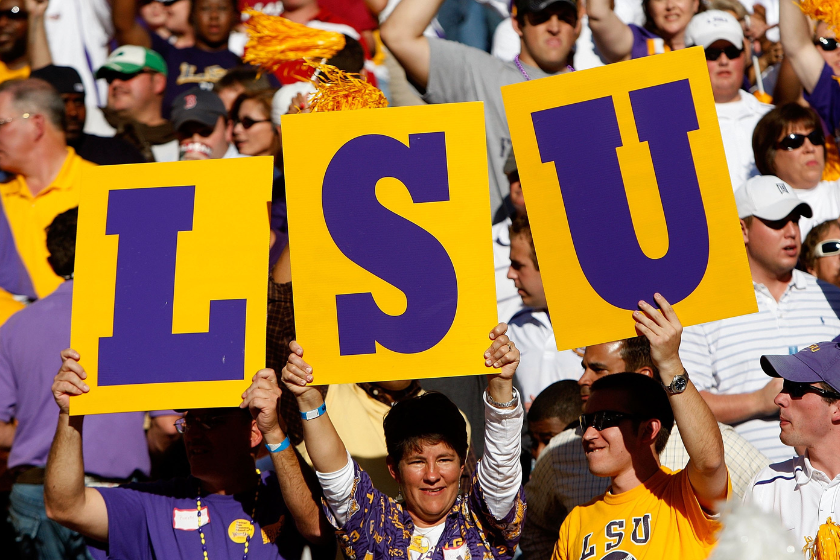 Fans of the Louisiana State University Tigers hold up a sign against the Alabama Crimson Tide