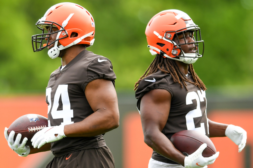 Nick Chubb #24 and Kareem Hunt #27 of the Cleveland Brown run a drill during the Cleveland Browns OTAs
