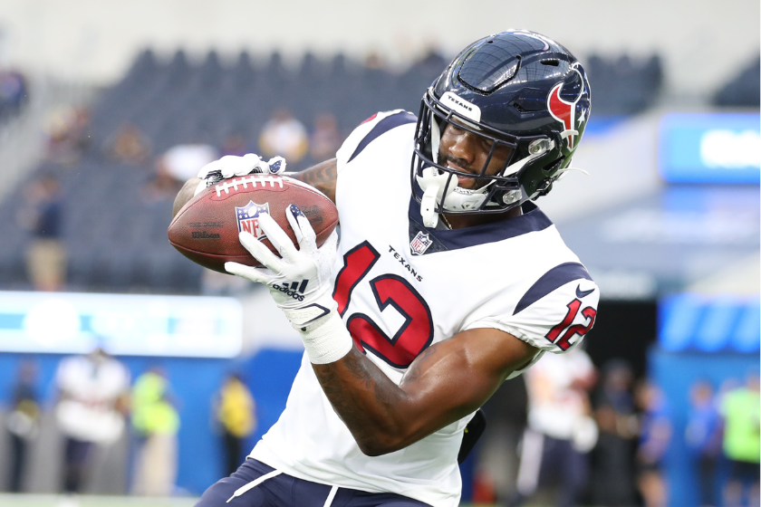 Nico Collins #12 of the Houston Texans makes a catch prior to kickoff against the Los Angeles Rams