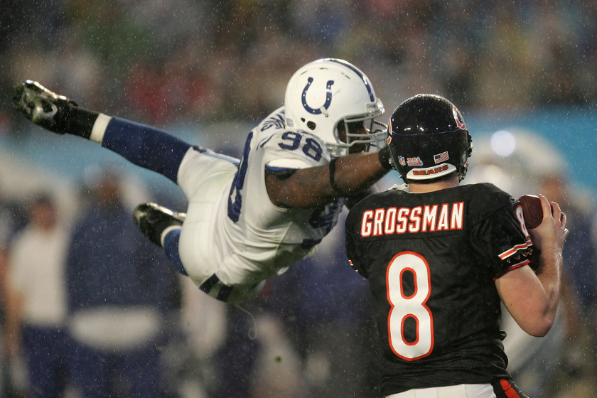 Quaterback Rex Grossman #8 of the Chicago Bears drops back to pass as Robert Mathis #98 of the Indianapolis Colts dives in during Super Bowl XLI 