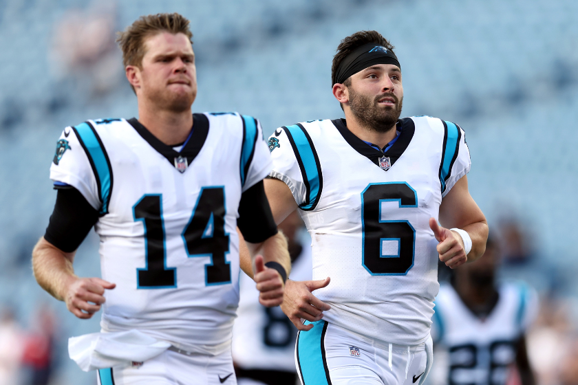 Sam Darnold #14 of the Carolina Panthers and Baker Mayfield #6 warm up before the preseason game