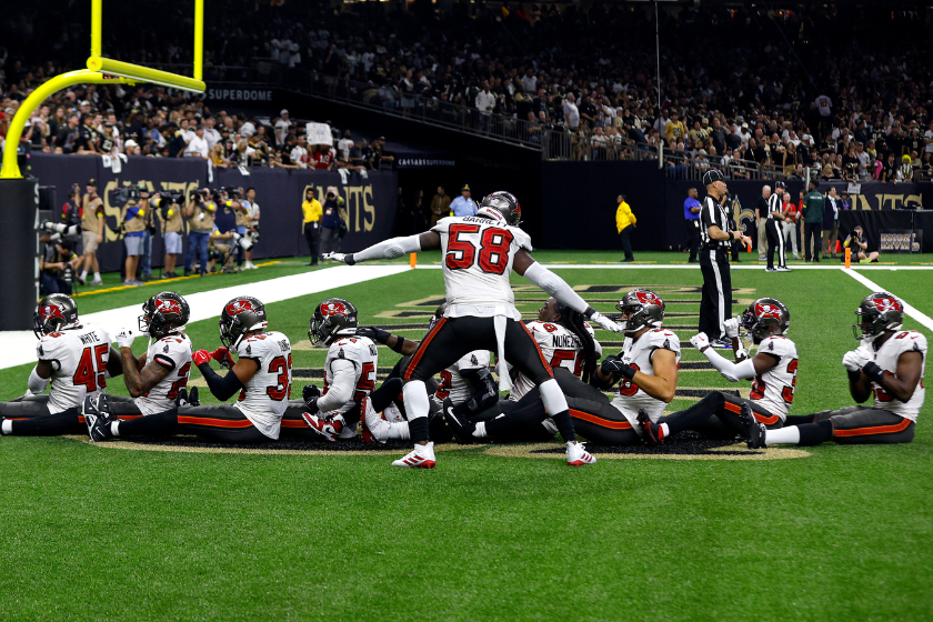 Jamel Dean #35 of the Tampa Bay Buccaneers celebrates with his teammates after an interception