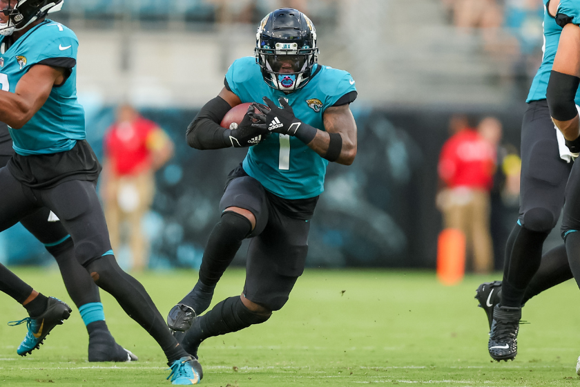 Travis Etienne Jr. #1 of the Jacksonville Jaguars runs against the Cleveland Browns during a football game
