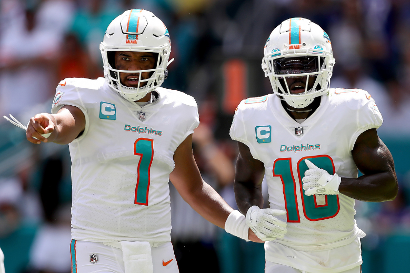 Tua Tagovailoa #1 and Tyreek Hill #10 of the Miami Dolphins in action during the first half of the game against the Buffalo Bills
