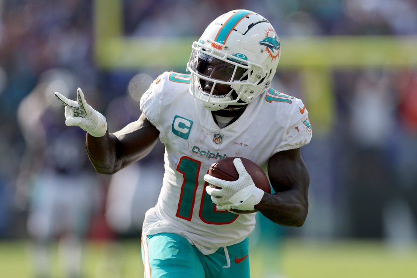 Tyreek Hill #10 of the Miami Dolphins celebrates a touchdown catch against the Baltimore Ravens