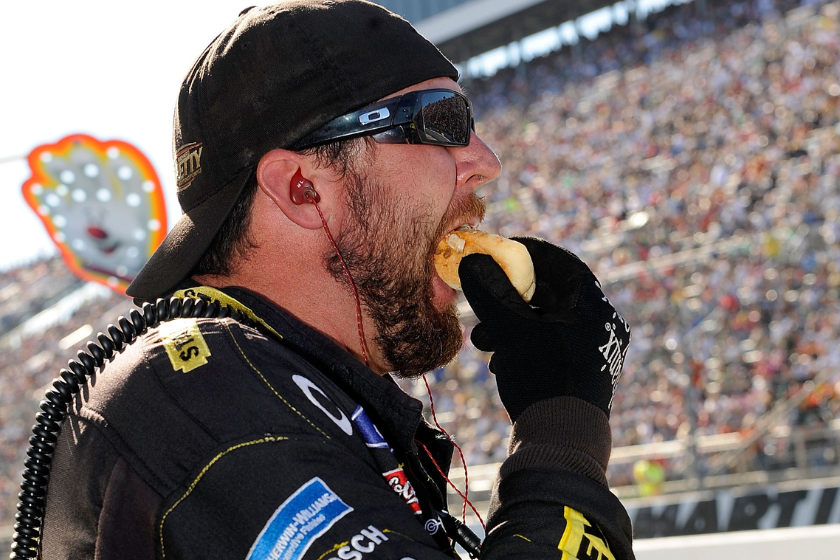 A crew member eats a Martinsville hot dog Slider during the 2010 TUMS Fast Relief 500 at Martinsville Speedway