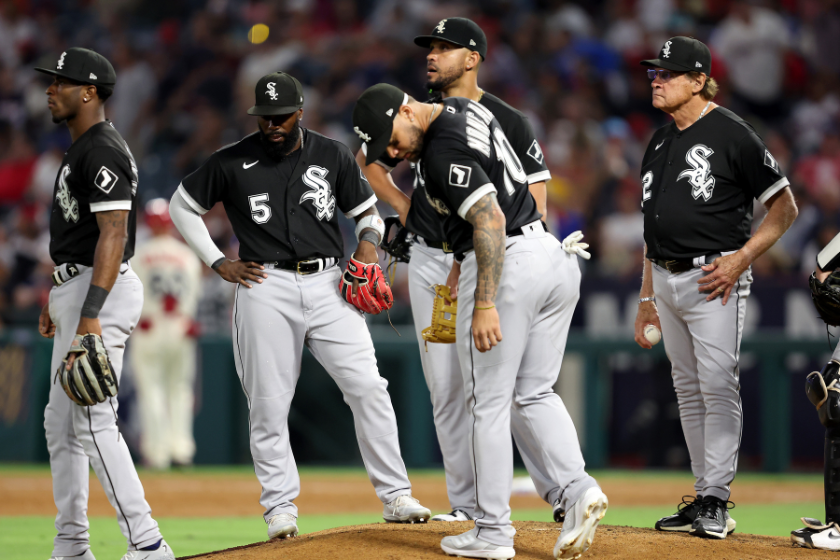 Josh Harrison #5, Yoan Moncada #10 and Manager Tony LaRussa of the Chicago White Sox look on from the mound during the sixth inning of a game 