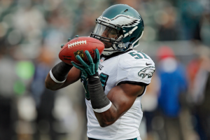 inebacker Emmanuel Acho #51 of the Philadelphia Eagles catches a pass while warming up before a game against the Oakland Raiders