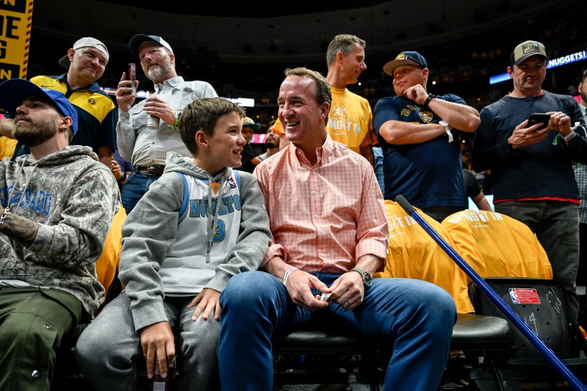 Peyton Manning and his son, Marshall, at an NBA game.