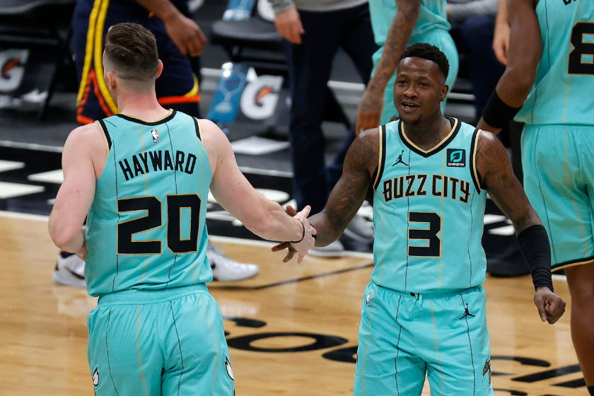 Terry Rozier #3 and Gordon Hayward #20 of the Charlotte Hornets react following a play during the second quarter of their game against the Golden State Warriors at Spectrum Center 