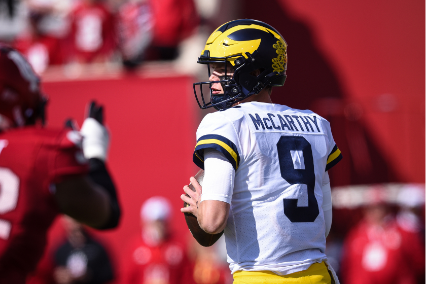 Michigan QB J.J. McCarthy (9) drops back into the pocket during a college football game between the Michigan Wolverines and Indiana Hoosiers