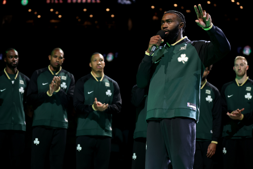 Jaylen Brown #7 of the Boston Celtics speaks in tribute to former Celtics player Bill Russell before the game against the Philadelphia 76ers at TD Garden