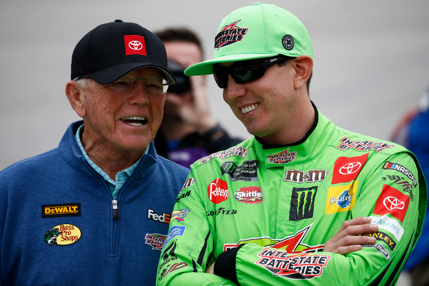 Joe Gibbs talks with Kyle Busch prior to the start of the 2019 Drydene 400 at Dover International Speedway