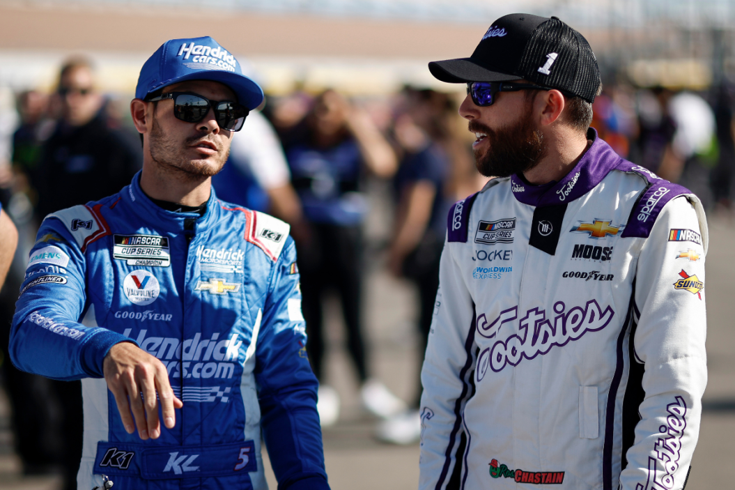Kyle Larson and Ross Chastain talk on the grid during qualifying for the South Point 400 at Las Vegas Motor Speedway