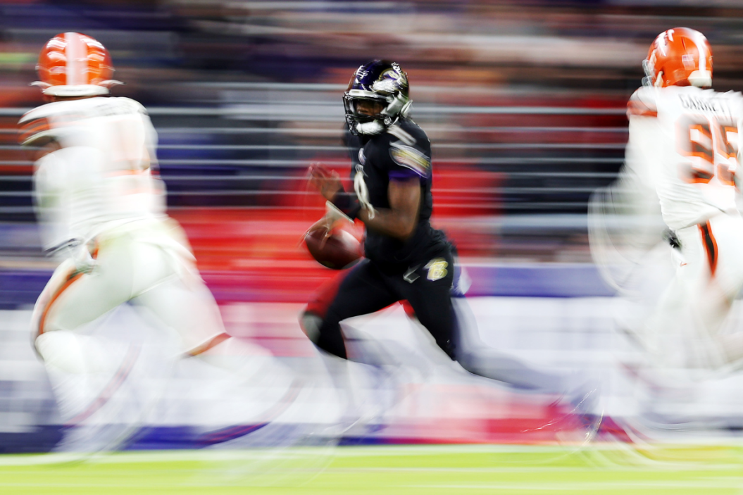 Lamar Jackson #8 of the Baltimore Ravens scrambles during a game against the Cleveland Browns at M&T Bank Stadium