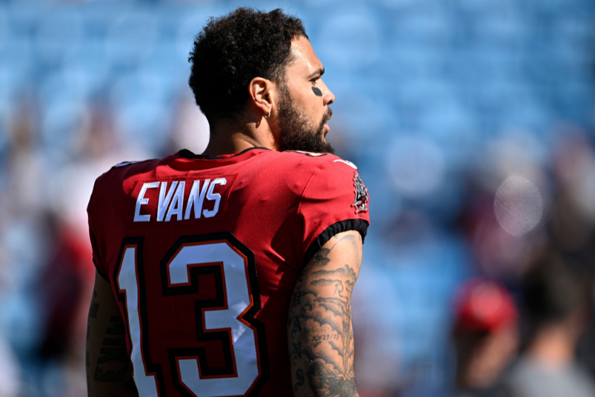 Mike Evans #13 of the Tampa Bay Buccaneers walks onto the field durign warm ups prior to the game against the Carolina Panthers