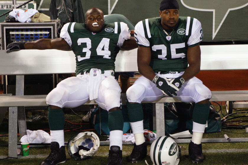 Two Jets players look dejected after losing to the Dallas Cowboys.